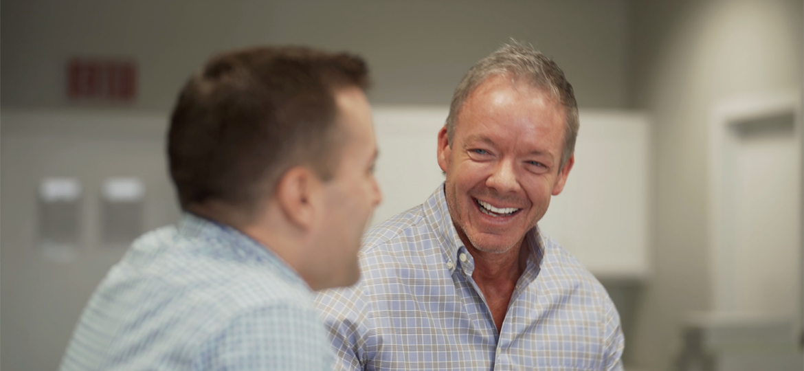 CEO Matt Boelman laughing in a meeting
