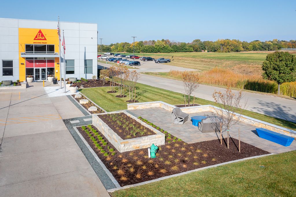 Colorbiotics exterior patio with perennial plantings in straight-line design landscape concept